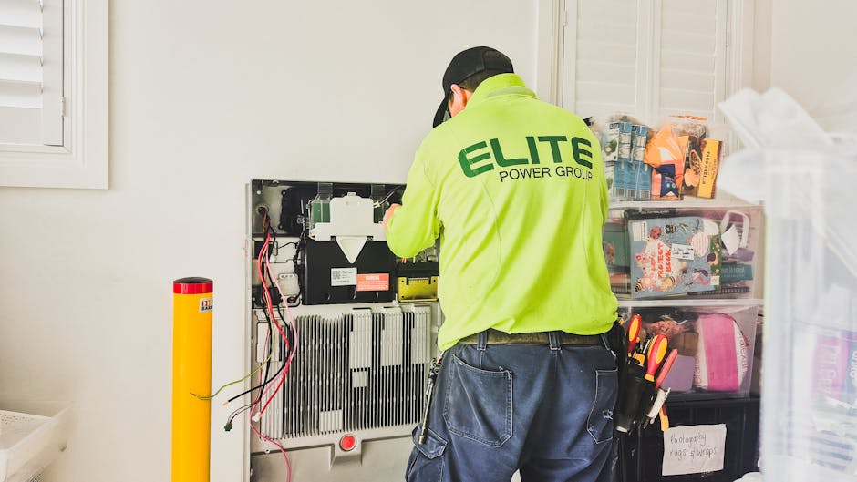 Happy satisfied homeowner with professional electrician after successful electrical panel upgrade work